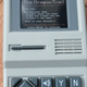 The handheld is designed to look like a miniature version of the classic Apple II person computer, including a semi-functional floppy disk power button.